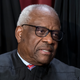 Associate Justice Clarence Thomas joins other members of the Supreme Court as they pose for a new group portrait, at the Supreme Court building in Washington, Friday, Oct. 7, 2022. Justice Thomas was nominated by President George H. W. Bush to succeed Justice Thurgood Marshall and has served since 1991.